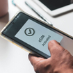A person's mobile phone displaying "eSIM activated"