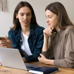 Two people at a laptop