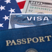 A picture of a visa and passport overtop American flag and dollar bill