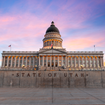 The front of the State of Utah capital building at sunset.