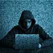 Grainy image of computer code atop hooded hacker using laptop