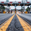 Approaching a busy toll plaze on a highway