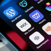 Assorted website builder apps on smartphone