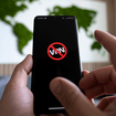 Icon of blocked VPN on a black smartphone screen.