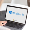Notebook with Microsoft Windows 10 logo.