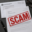 Letter addressed from the IRS with bold red SCAM stamped across it.