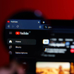 A closeup of a magnifying glass on YouTube desktop