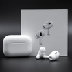 Apple AirPods Pro 2nd generation next to charging case and packaging box on black background.