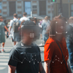 Crowd of people unknowingly getting their faces scanned.