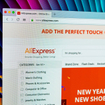 Aliexpress.com website homepage on Apple iMac monitor screen.