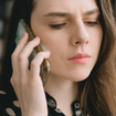 Woman engaged in a phone conversation.