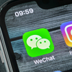 Wechat messenger application icon on Apple iPhone X smartphone screen close-up. 