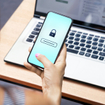 Woman inputting password on her phone.
