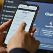 Person using ChatGPT on mobile and laptop