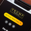 Smartphone screen displaying Trump Mobile’s call-to-action website page with yellow “Join Today” button and social media icons.
