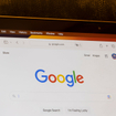 Google's website homepage is seen on a MacBook Air laptop.