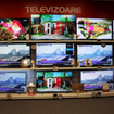 Shelves full of LED TVs in a store.