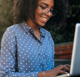 woman looking at her laptop computer