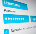 A close-up of a website login screen with username and password highlighted in blue and the option to remember my username selected