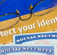 Some text that reads &quot;protect your identity&quot; with two Social Security cards underneath.