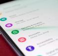 A close-up of an Android phone with a focus on the Security &amp; Location settings button.