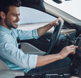 Man driving car pressing screen on the car panel