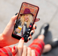 Person holding phone with TikTok content.
