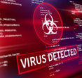 A closeup of a computer screen with the words &quot;virus detected&quot; 