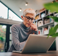 Woman looking at laptop