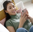 Girl smiling at phone