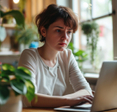 Woman looking concerned at laptop