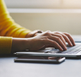 Person typing on laptop