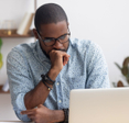 Man looking concerned at laptop