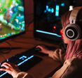 A woman games on her computer.