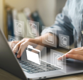 Person works on a laptop and clicks on virtual files.