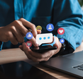 Text bubbles and emojis float above a phone.