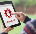 Man turning on ad blocker on his iPad