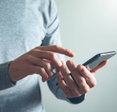 A person holding a smartphone.