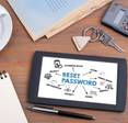 Reset Password. Text on tablet device on a wooden table
