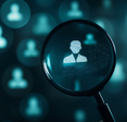 Concept of exposed digital data: magnifying glass highlighting a digital profile