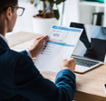 A man reads a credit report.