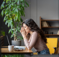 Woman looking at laptop