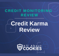A blue background with images of locks and shields and the text &quot;Credit Karma Review&quot;