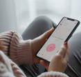 Woman using a period tracking app