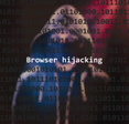 Concept of browser hijacking, a hooded hacker stands behind lines of code with text &quot;browser hijacking&quot; in white