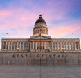 The front of the State of Utah capital building at sunset.