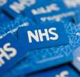 National Health Service logo on blue background