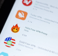 A closeup of free VPN apps like Hola and Turbo VPN on smartphone