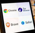 Display of various web browsers like Chrome, Tor, Brave, and Safari closeup on smartphone screen