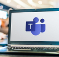 Laptop computer displaying logo of Microsoft Teams.